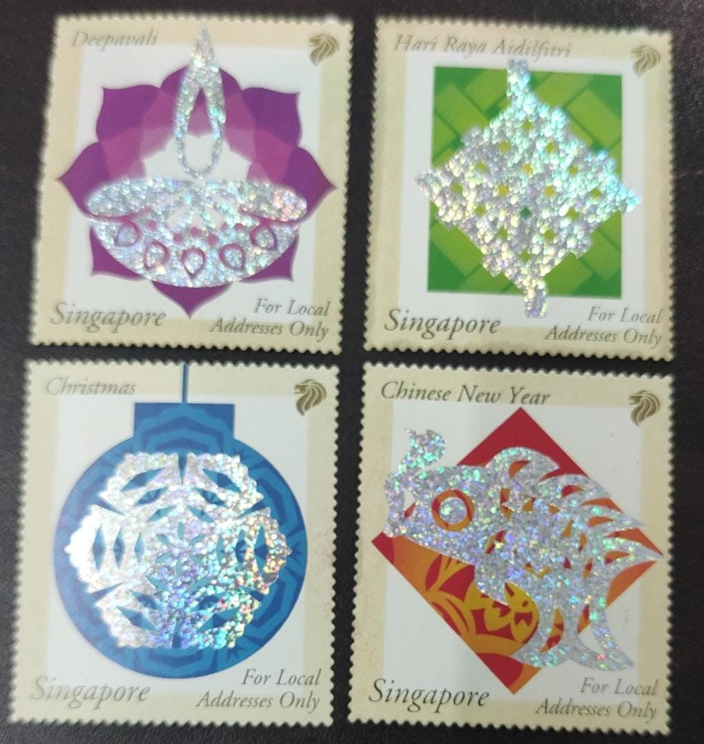 Singapore 4 beautiful stamps with silver glitter foil . Issued for 🪔 Diwali Idul fitr Christmas 🎄 and Chinese new year