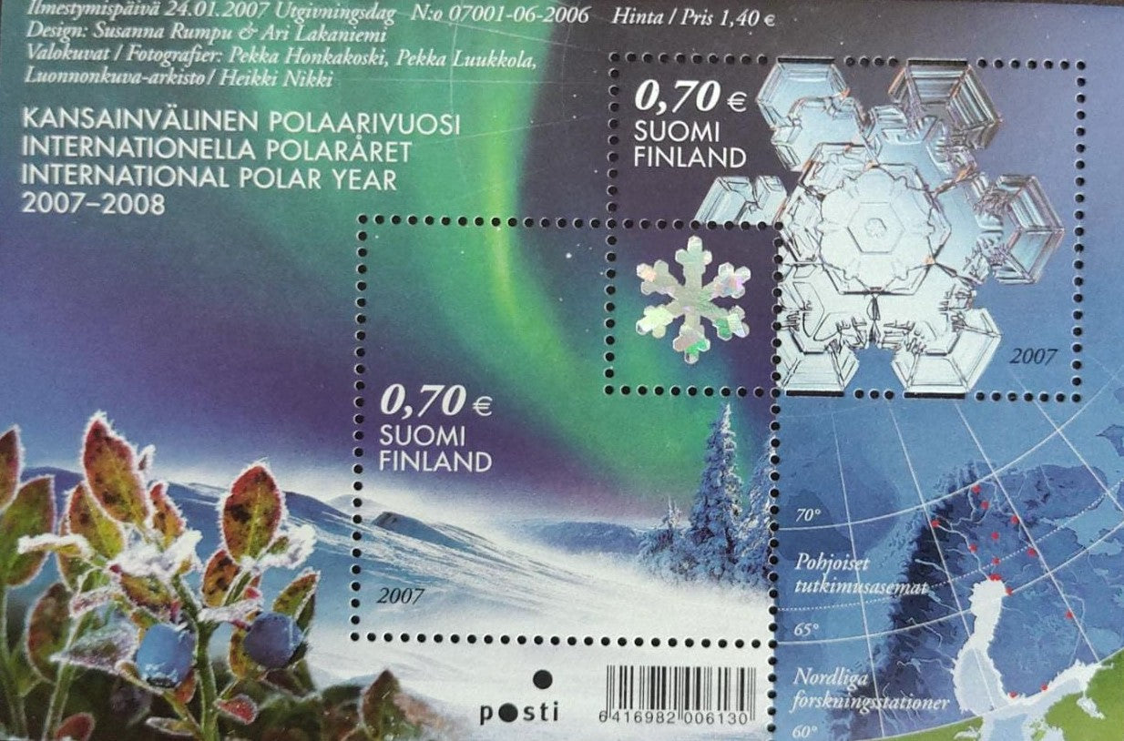 Finland ms with stamp in stamp and hologram inside that portion.