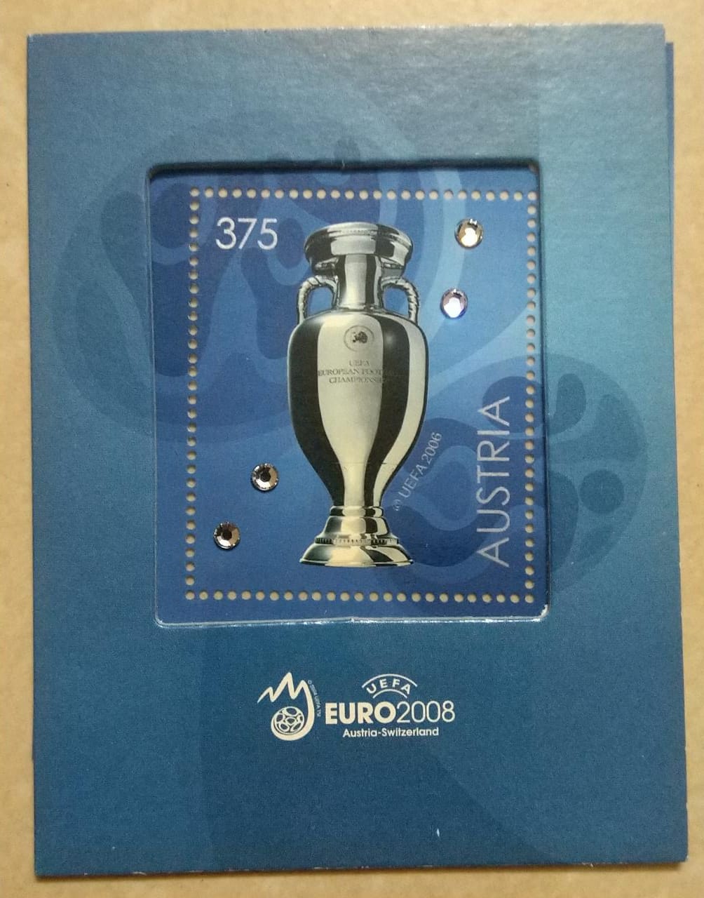 Austria issued a beautiful stamp in 2008 with 4 sworski crystals.