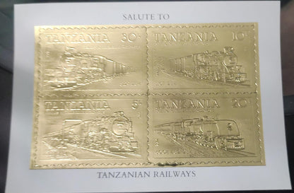 ट्रेनों पर 4 अलग-अलग स्वयं चिपकने वाले टिकटों की तंजानियाई 22 कैरेट गोल्ड फ़ॉइल एमएस।