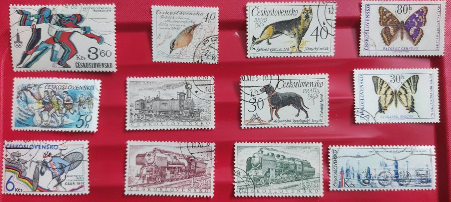Ceskoslovensko 12 diff stamps - themes like sports olympics, birds, dogs, butterfly,  trains.