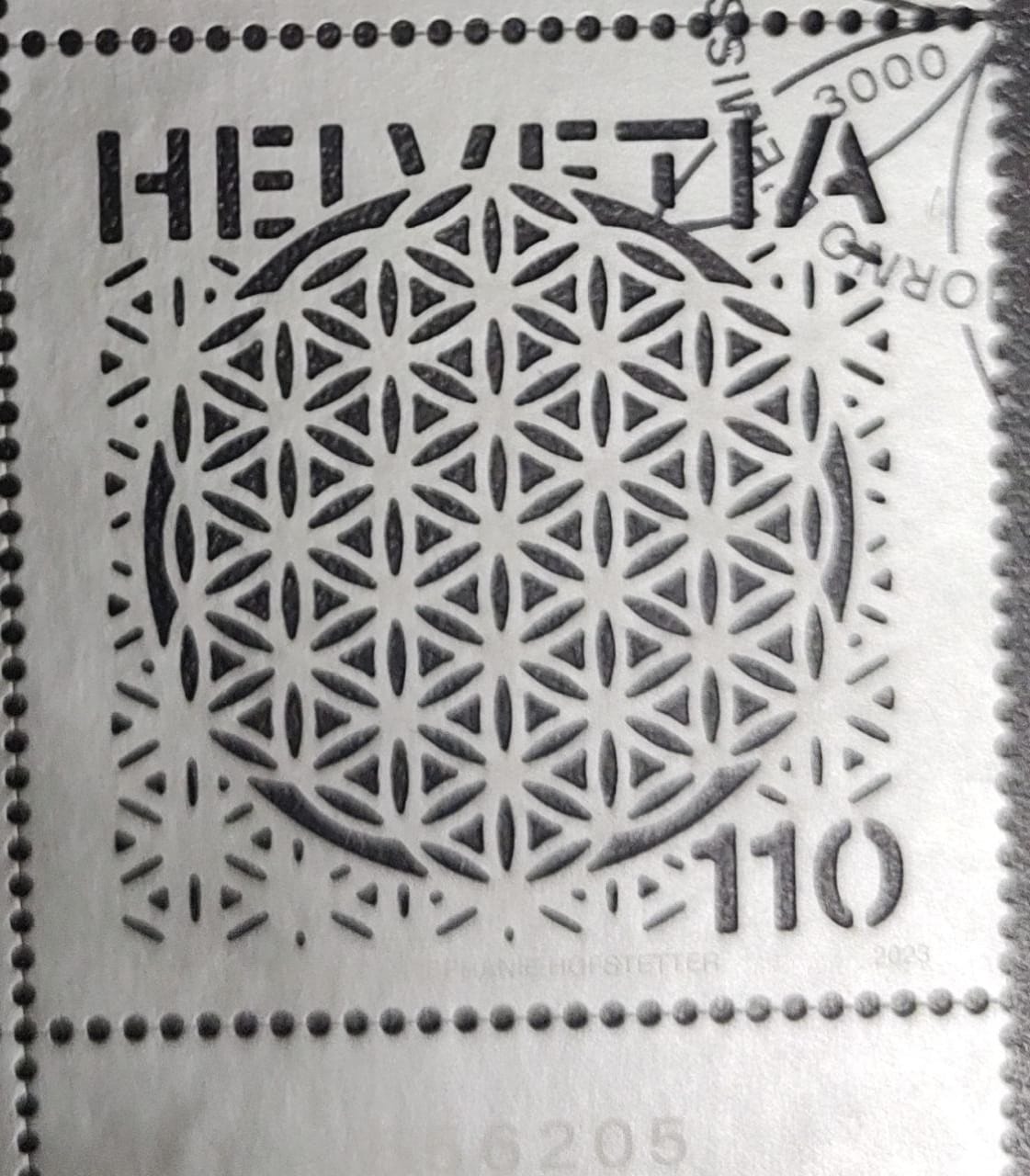 Swiss laser cut first day cancelled stamp on Flower of life.