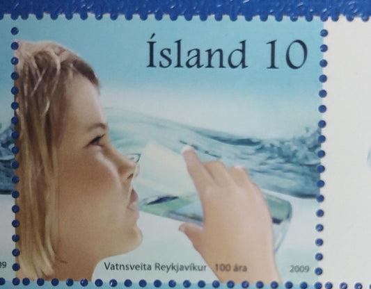 Island- save water and drink pure water.  Stamp with UV shining print.