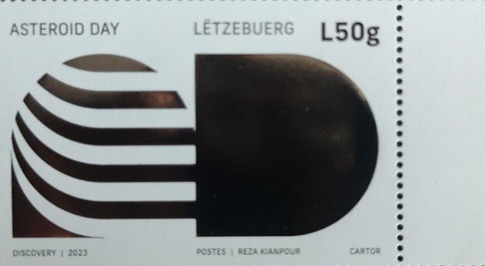 Luxembourg asteroid day stamp with holographic silver foiling.
