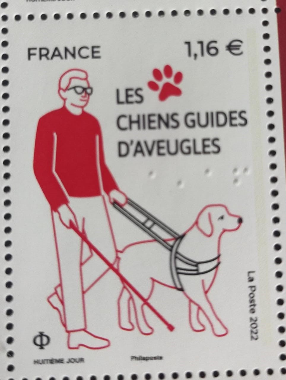 दृष्टिहीन फ़्रांस के लिए मार्गदर्शक कुत्तों पर ब्रेल लेखन के साथ मोहर।