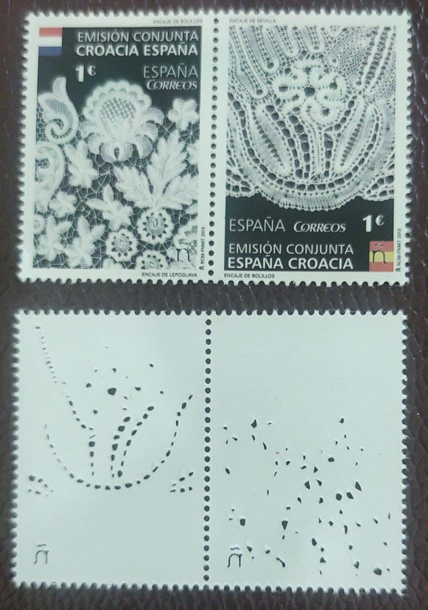 Spain beautiful setenent pair on embroidery. The stamps have laser cut holes- shown on back image.