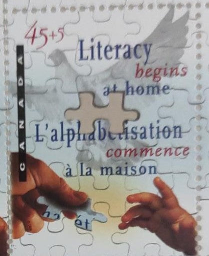 1996 Canada stamp on literacy with laser cut inside the stamp.