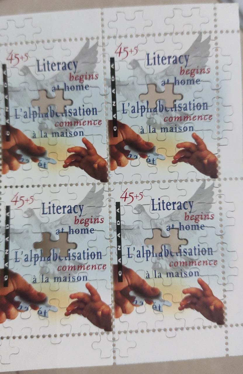 1996 Canada stamp on literacy with laser cut inside the stamp.
