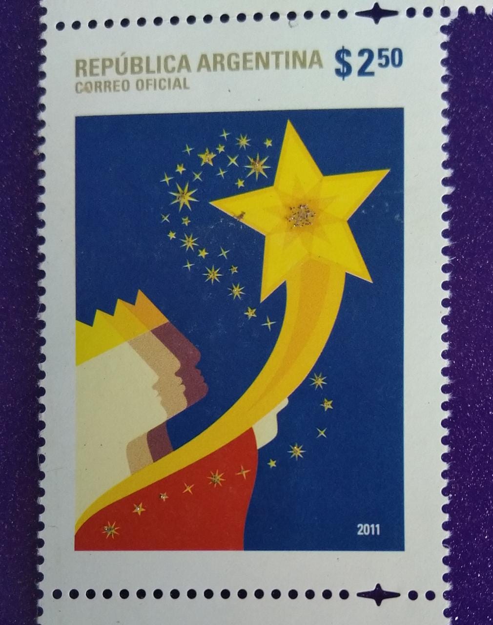 Argentina stamp with glitters affixed.