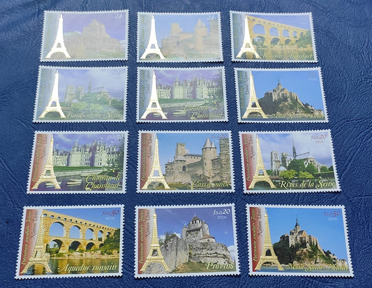 UN set of 6+6 beautiful stamps with gold embossed Eiffel tower from  New York and Geneva.