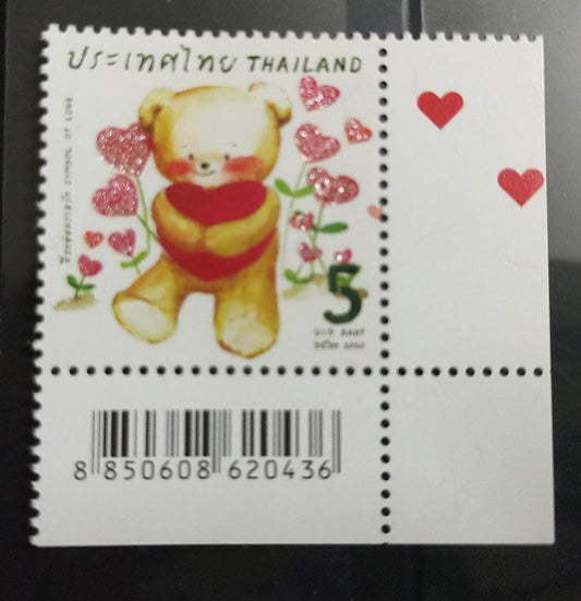 Thailand stamp with glitter on hearts.