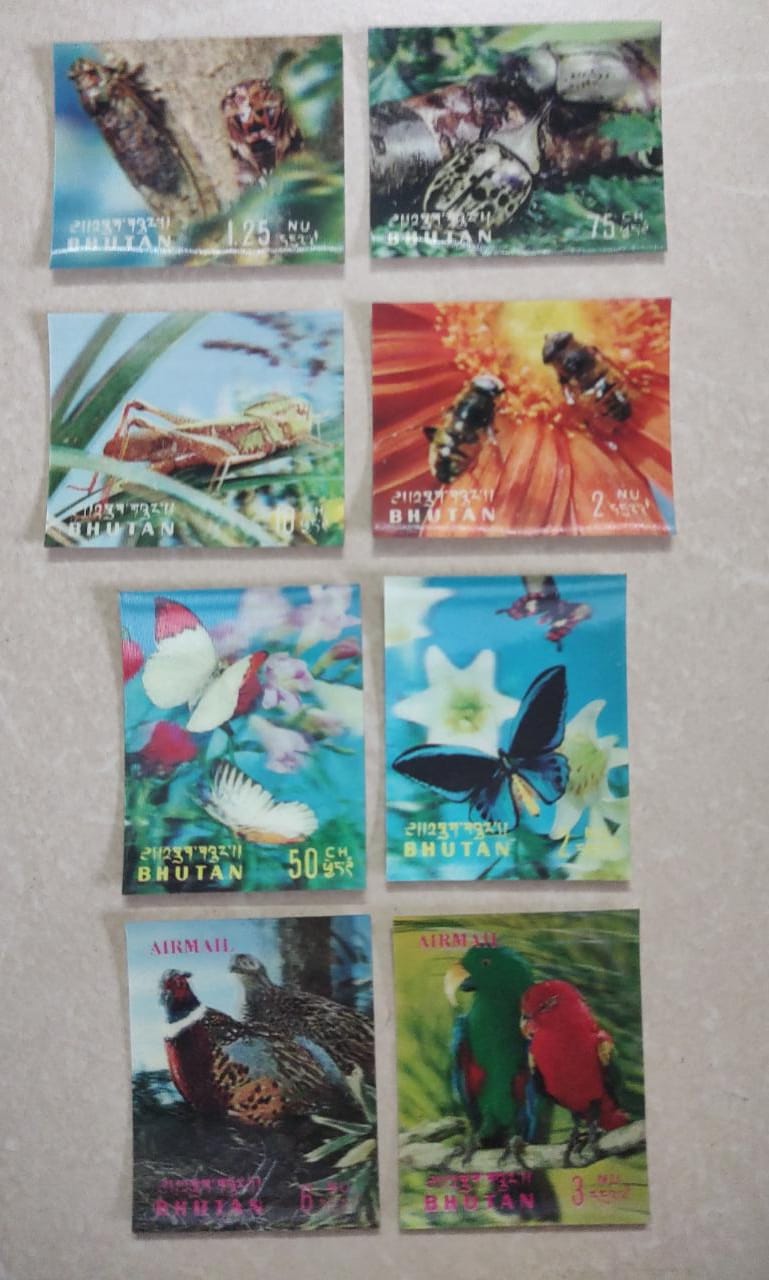 Bhutan 8 different 3D stamps on birds, insects and butterflies.