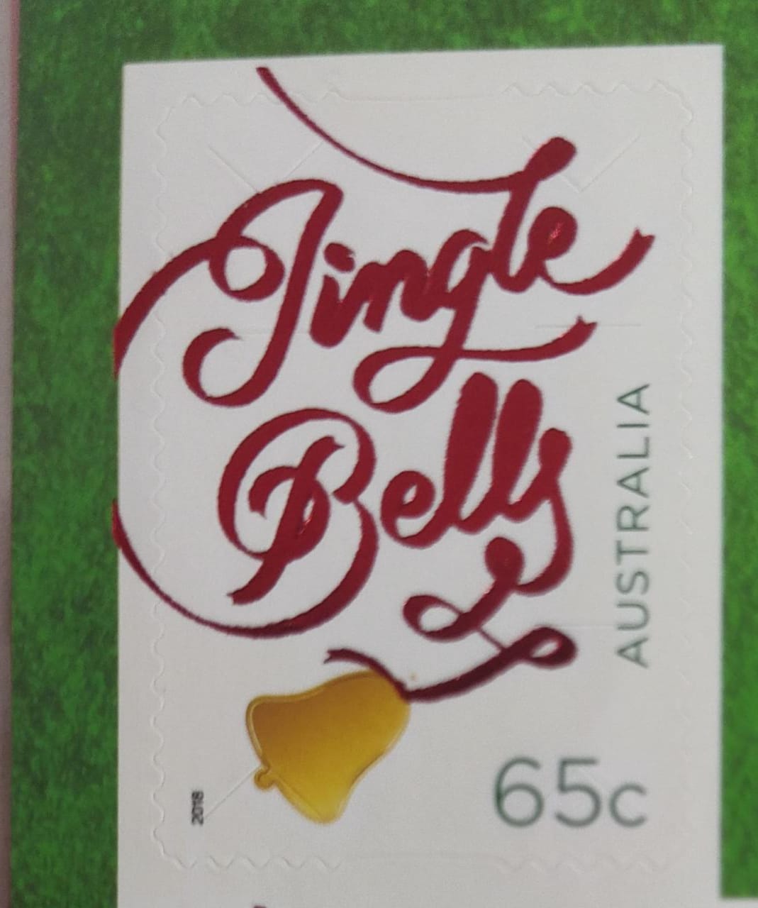 Australia 2018 greetings stamps with red holographic printing on the words jingle bells.